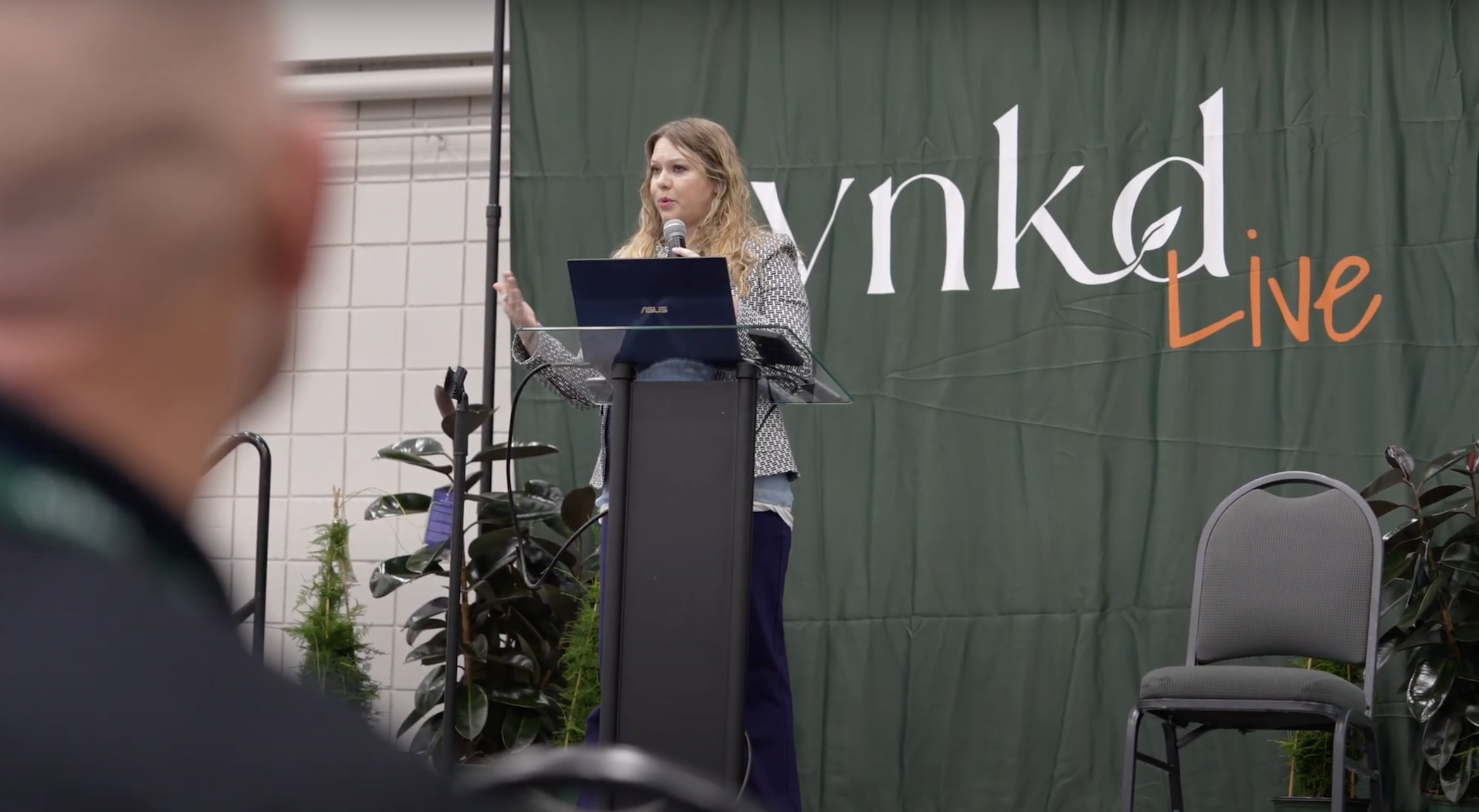 Robyn Schmitz, CEO of High Prairie Landscape Group, speaking at SYNKD Live 2024.